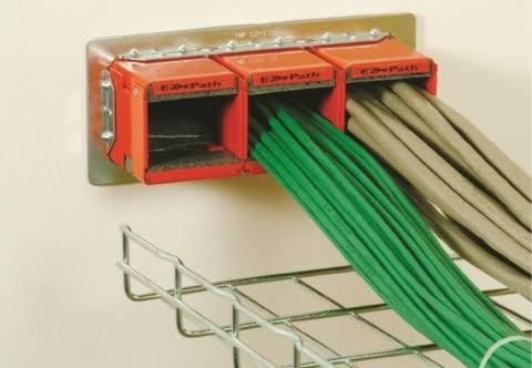 Fire-rated cable pathway sleeve in commercial wall
